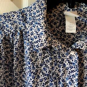 Long sleeve button-up career blouse with a fun and feminine botanical print.